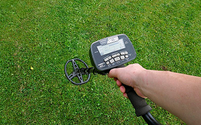 Person using a metal detector