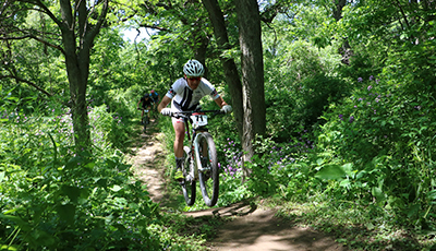 Mountain biking through the woods