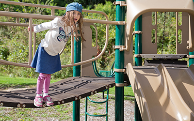 Child on play equipment