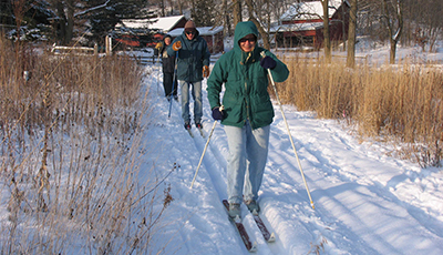 People smiling and skiing